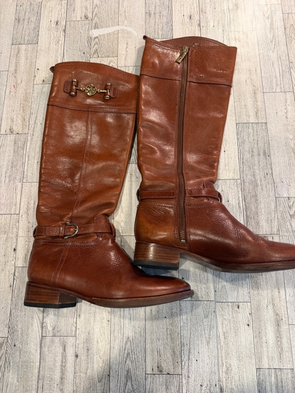 Tory Burch women’s brown Nadine zipper leather riding boots.